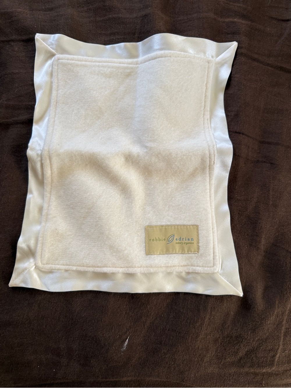 Pottery Barn Kids cream plush security blanket with satin trim